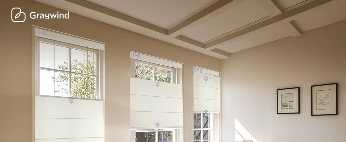 Light-filled room with large windows and a coffered ceiling, featuring Graywind logo.