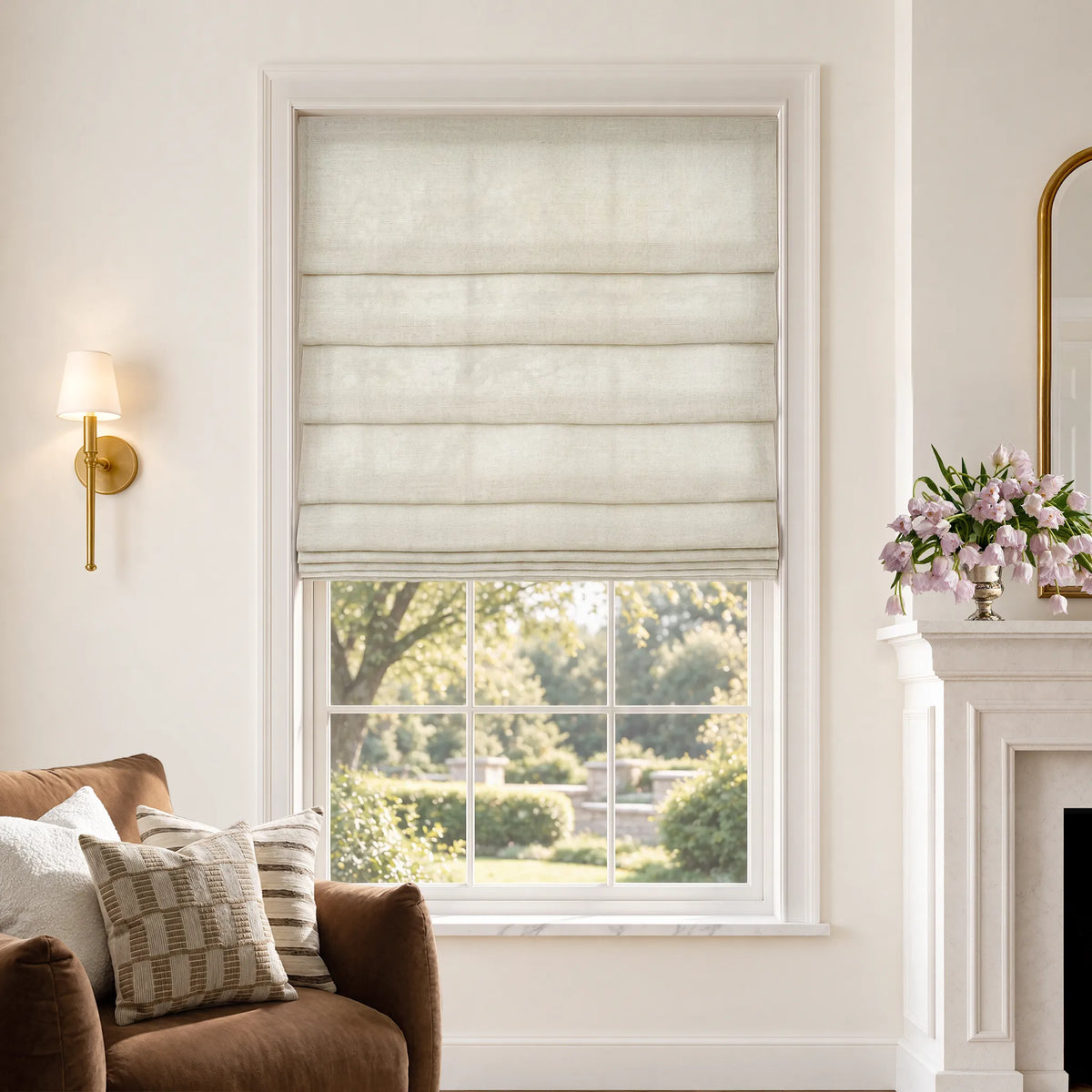 Soft fold Roman shades in Linear Wool White light-filtering fabric, partially raised to show cascading folds.