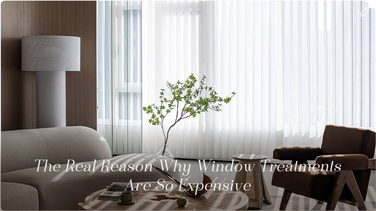 A picture of the sheer vertical blinds in a living room scene, with The caption: The Real Reason Why Window Treatments Are So Expensive