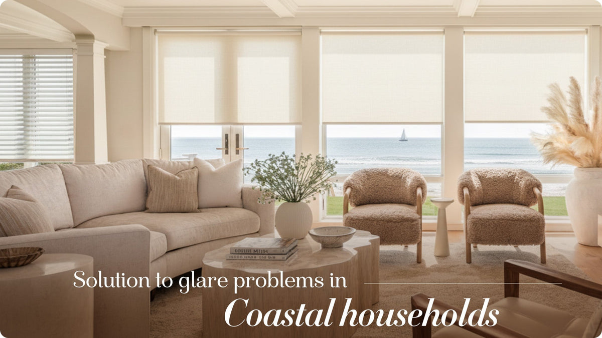 Modern coastal living room with beige smart window shades, ocean view, and stylish furniture