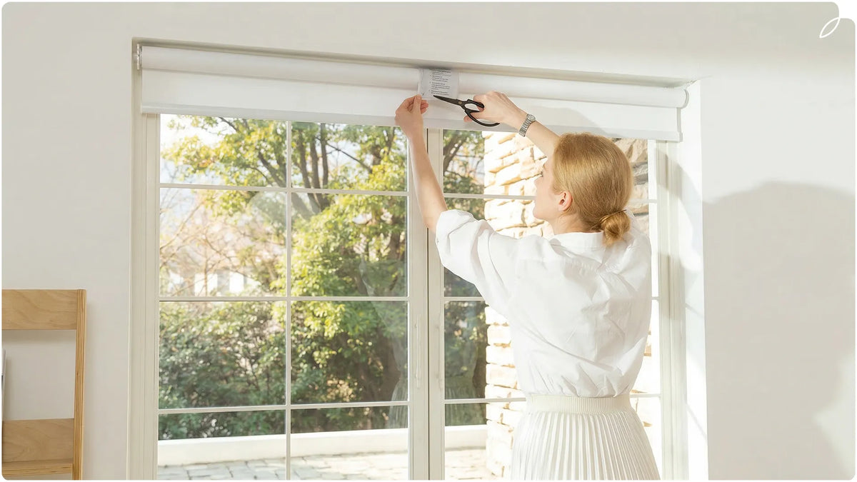 A woman has just installed the no drill shades