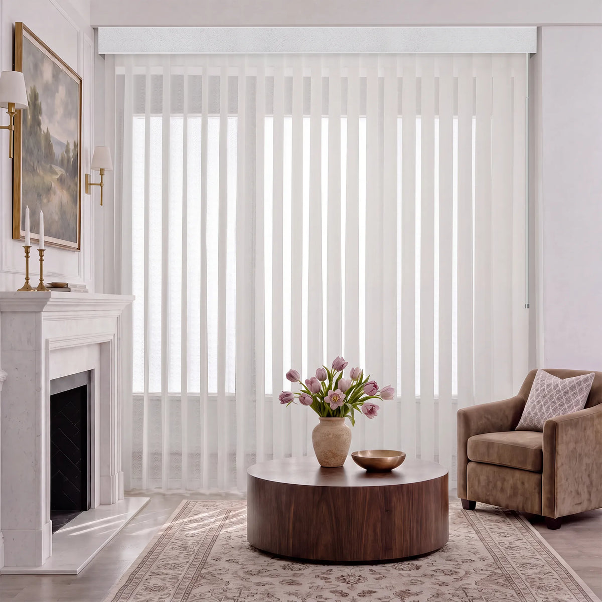 A living  room scene with white manual Sheer Vertical Blinds covering a large window, styled with a wooden sideboard, chairs, a round mirror, and a vase of tulips on the table.
