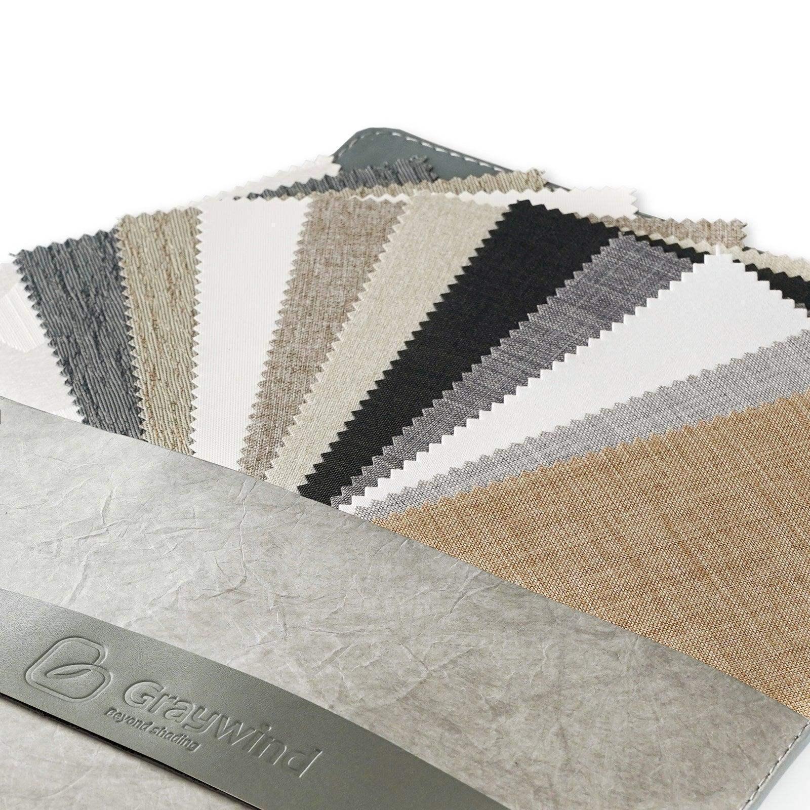 Assorted fabric swatches for custom window treatments in neutral colors display