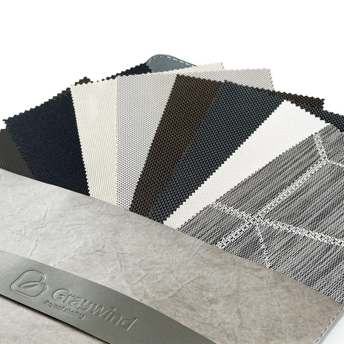 Custom window treatment fabric swatches in neutral colors, textured and patterned designs.
