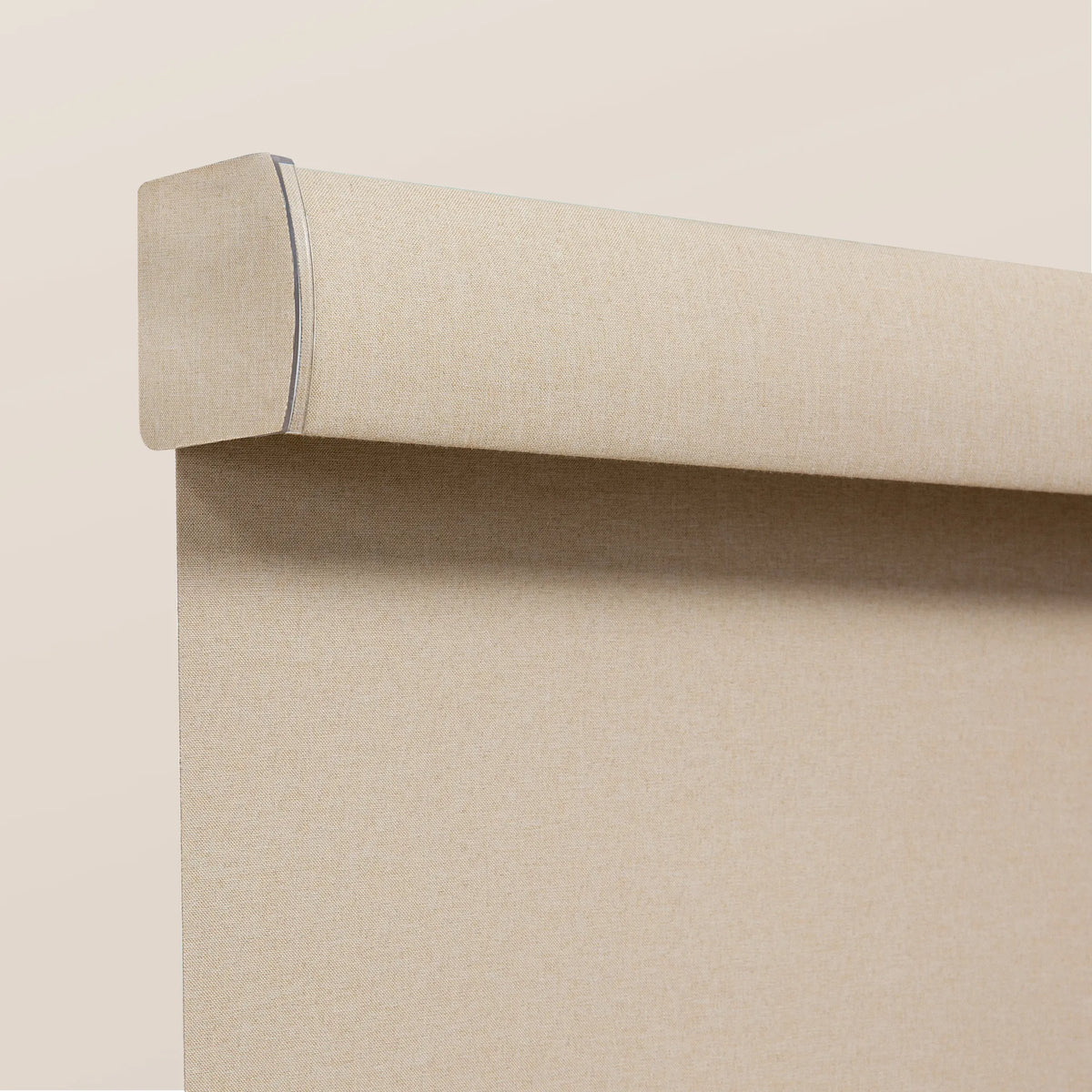 Blackout roller shades with a clean fabric valance detail for a modern window finish