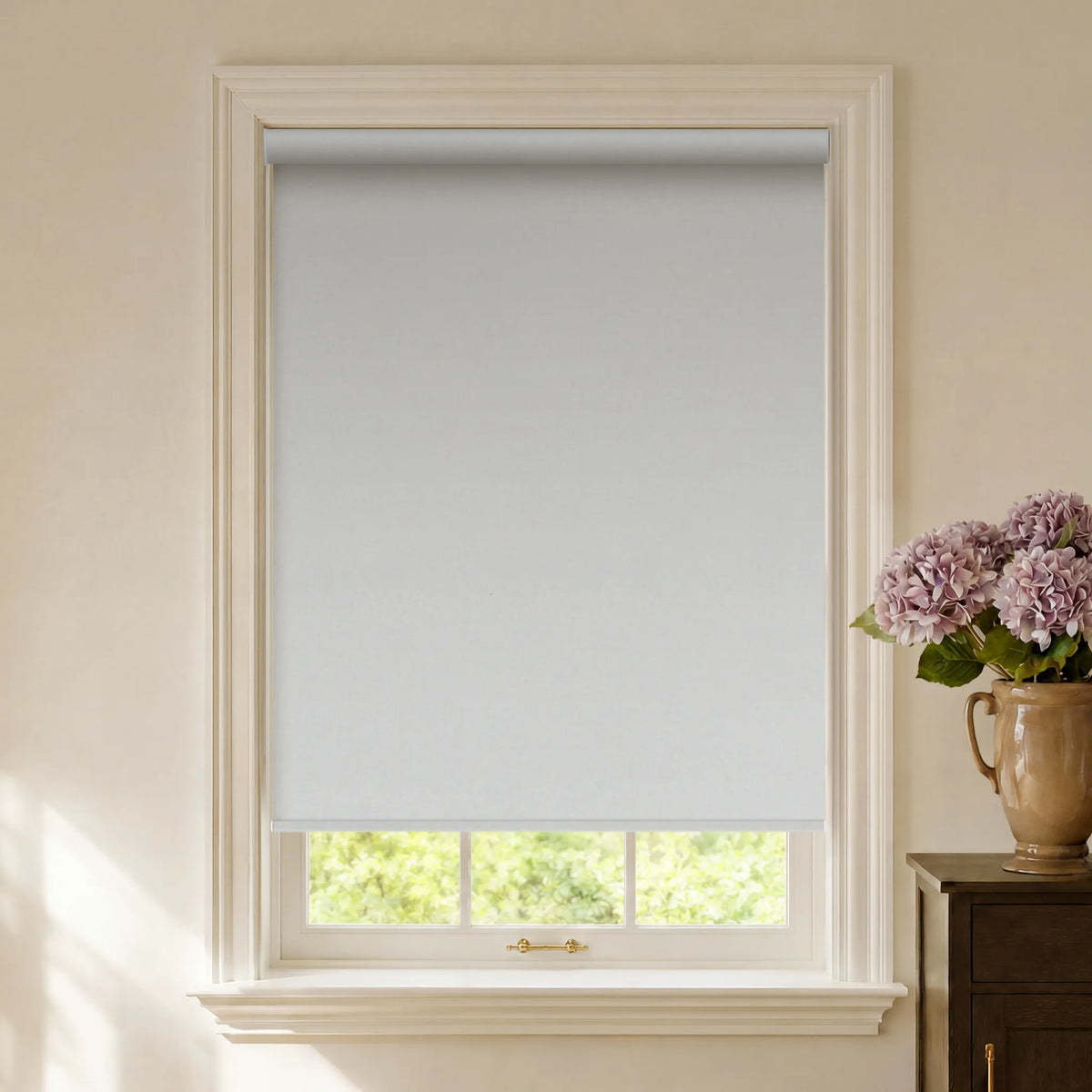 White fabric blackout roller shades for clean privacy and room darkening