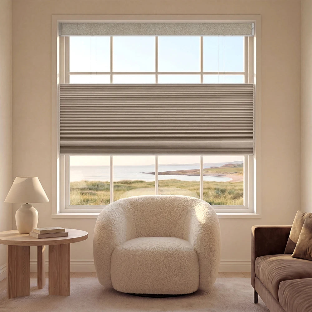 Living room with a window featuring a cordless top down bottom up window shade,a chair, and a side table.