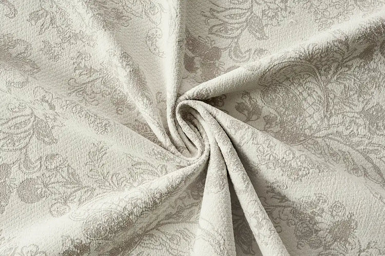 Beige patterned room darkening curtain fabric with soft texture for elegant interiors.