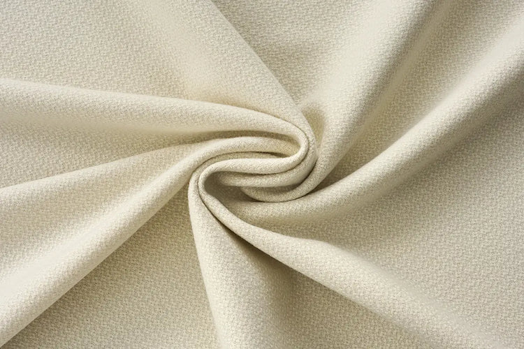 Cream room darkening curtain fabric with warm, cloud-like texture for custom drapes.