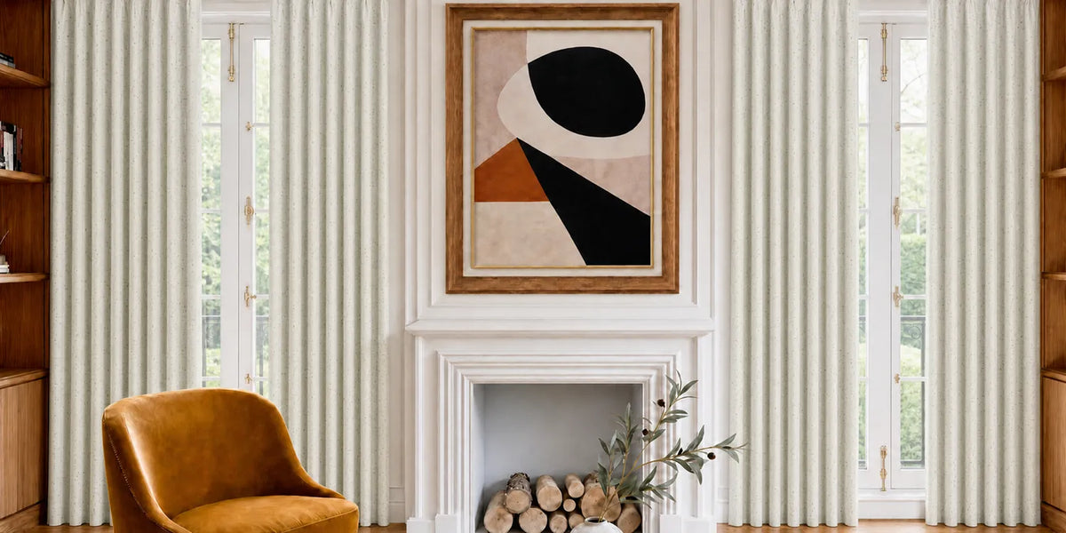Living room with striped curtains, a fireplace, and abstract art on the wall.