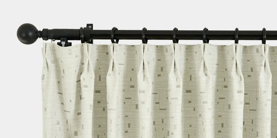 Curtain rod with a curtain on a white background