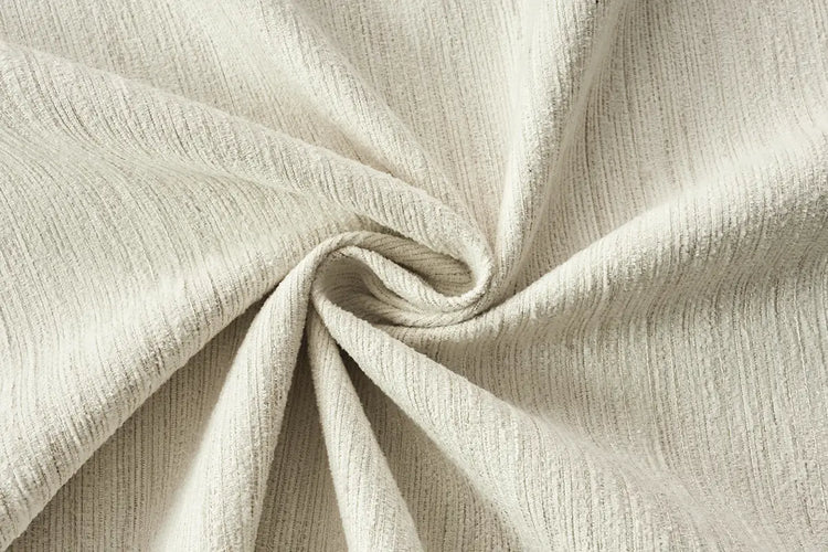 Cream light filtering curtain fabric with subtle shimmer for refined motorized curtains.