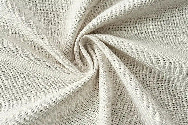 Beige light filtering curtain fabric with natural woven texture for custom drapes.