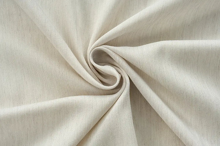 White light filtering curtain fabric with wool-blend texture for custom drapes.