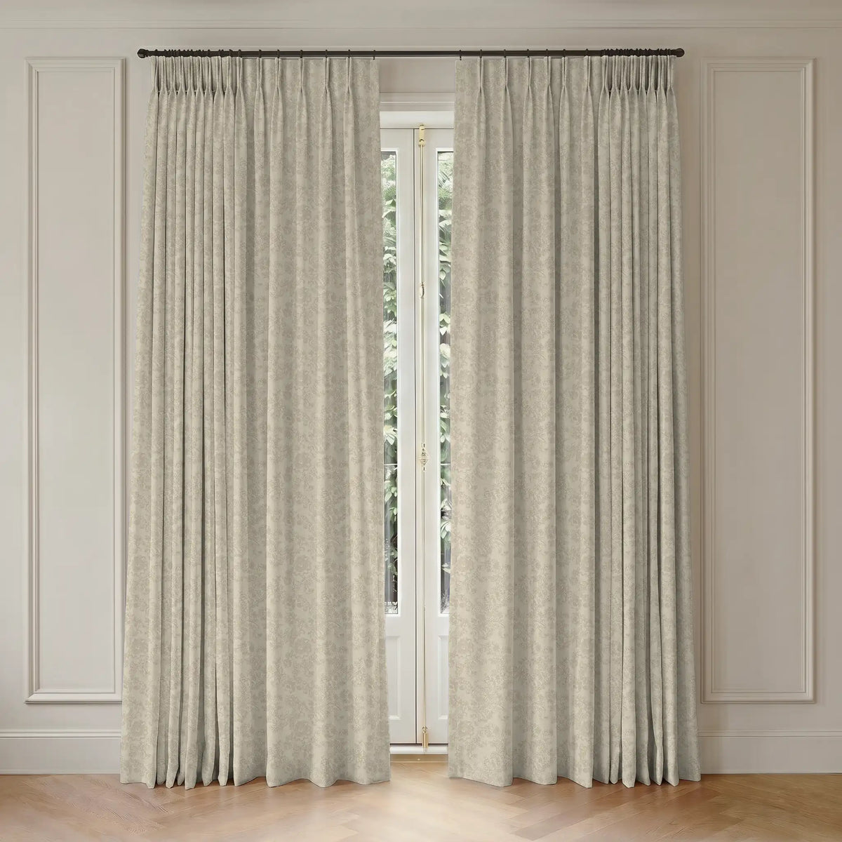 Pair of room darkening curtains hanging in front of a window with light-colored walls.