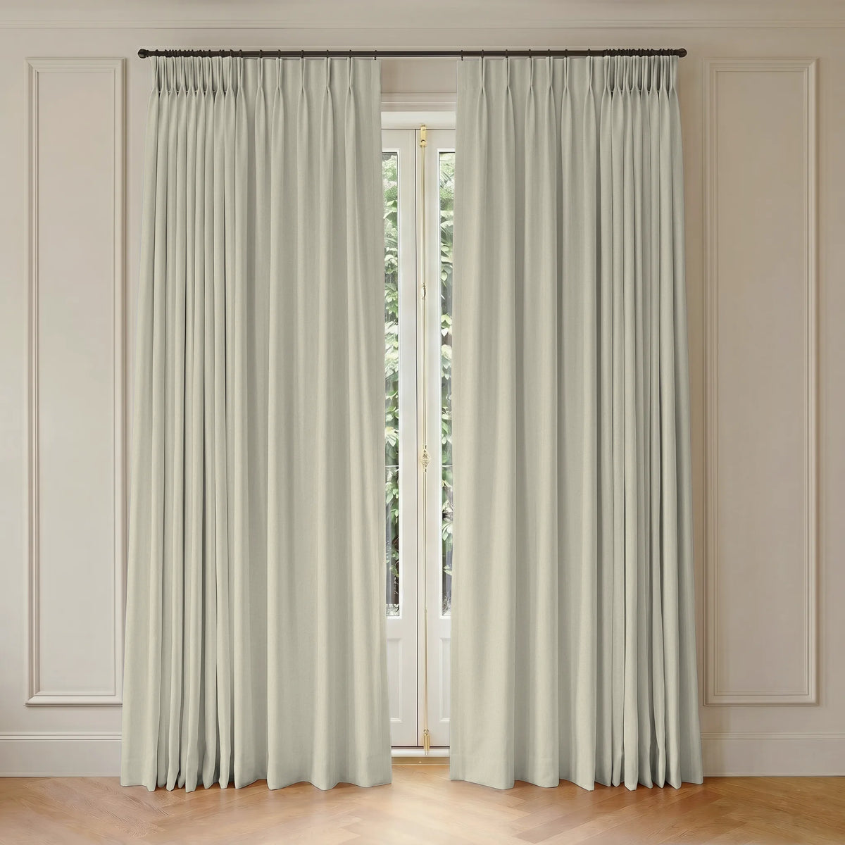 Pair of white motorized curtains hanging in front of a window with light-colored walls.