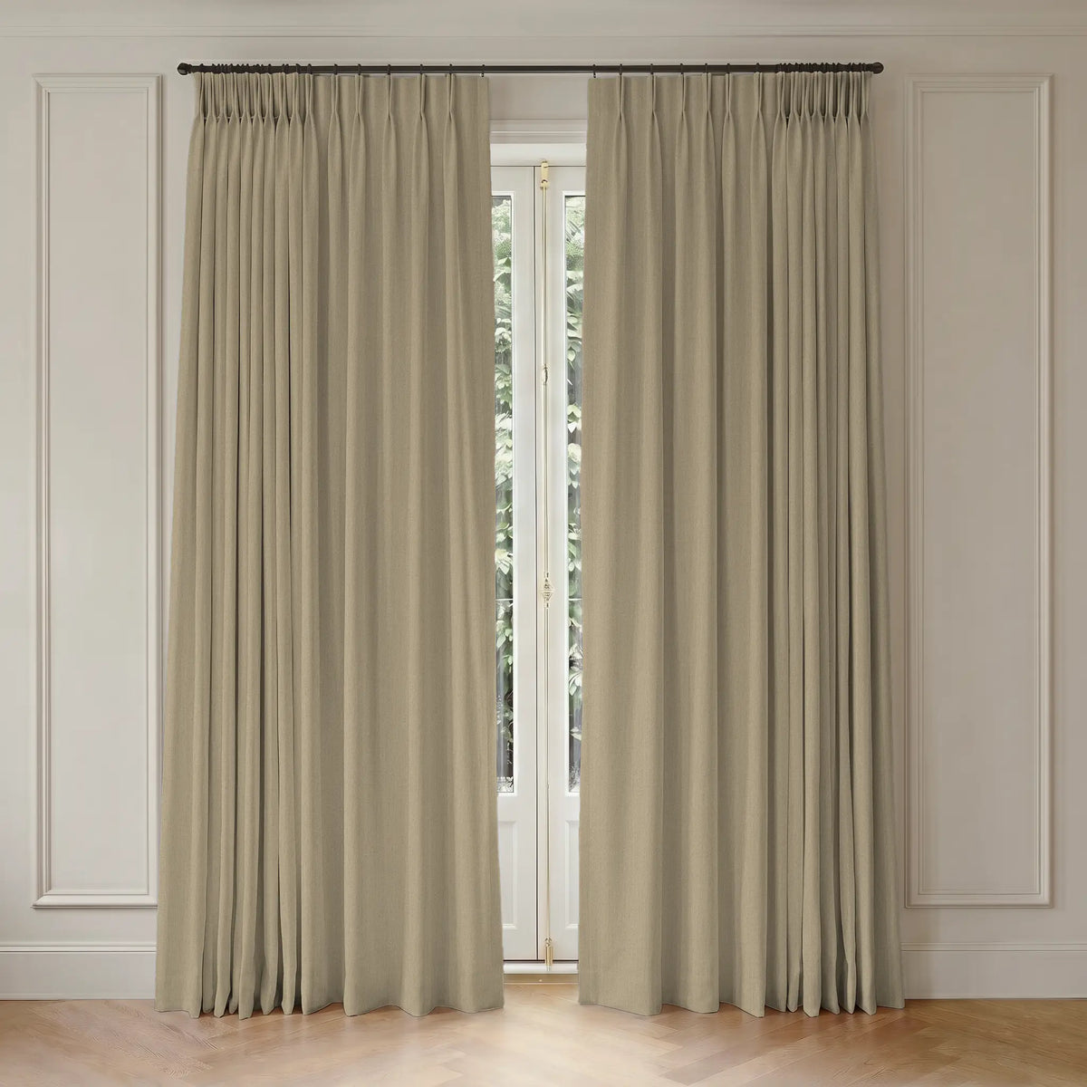Pair of  room darkening curtains hanging in front of a window with light-colored walls.