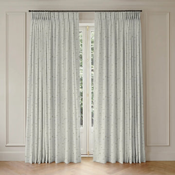 Pair of white smart curtains with a subtle pattern on a neutral wall background