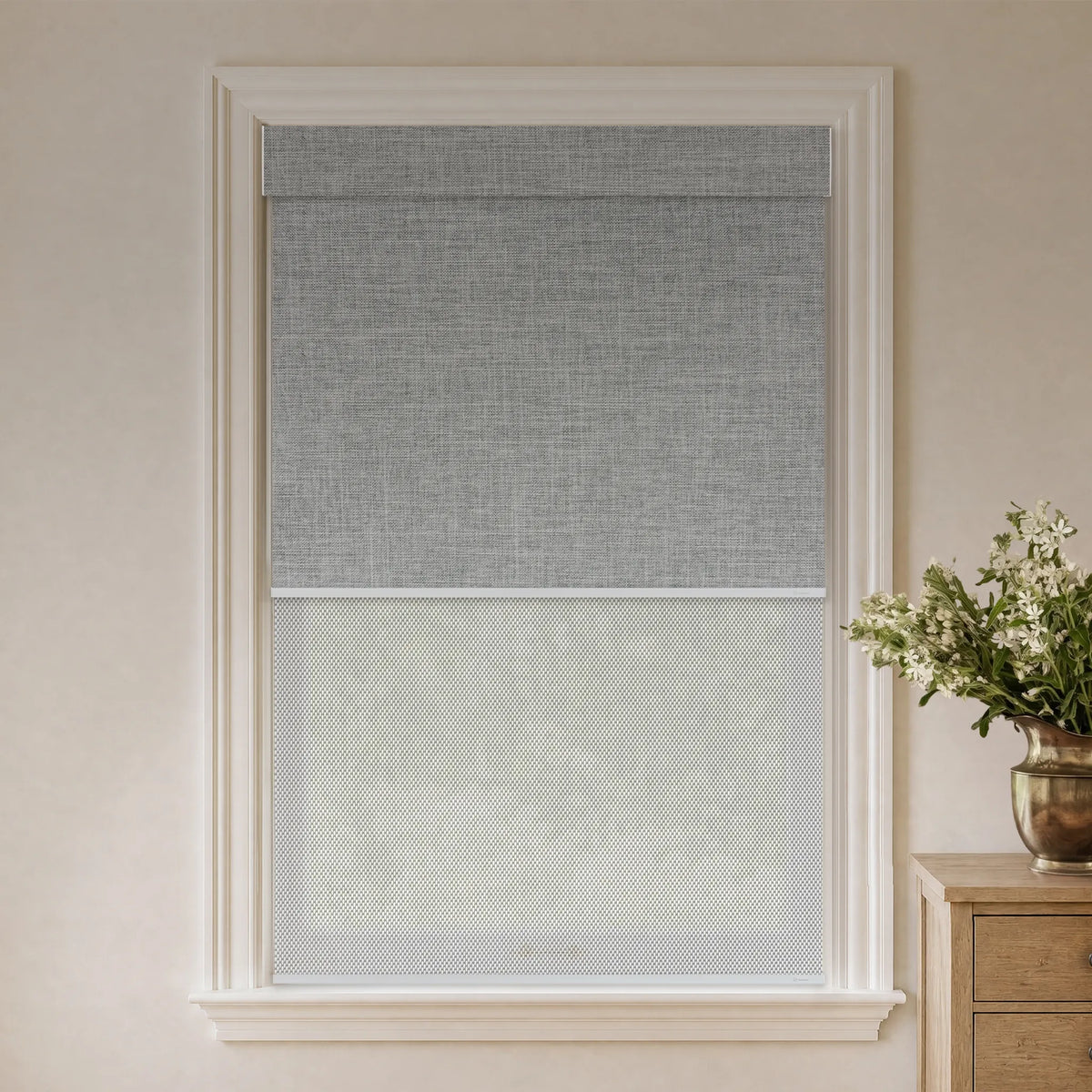 Light grey blackout dual roller shades with solar layer for glare reduction and daytime privacy