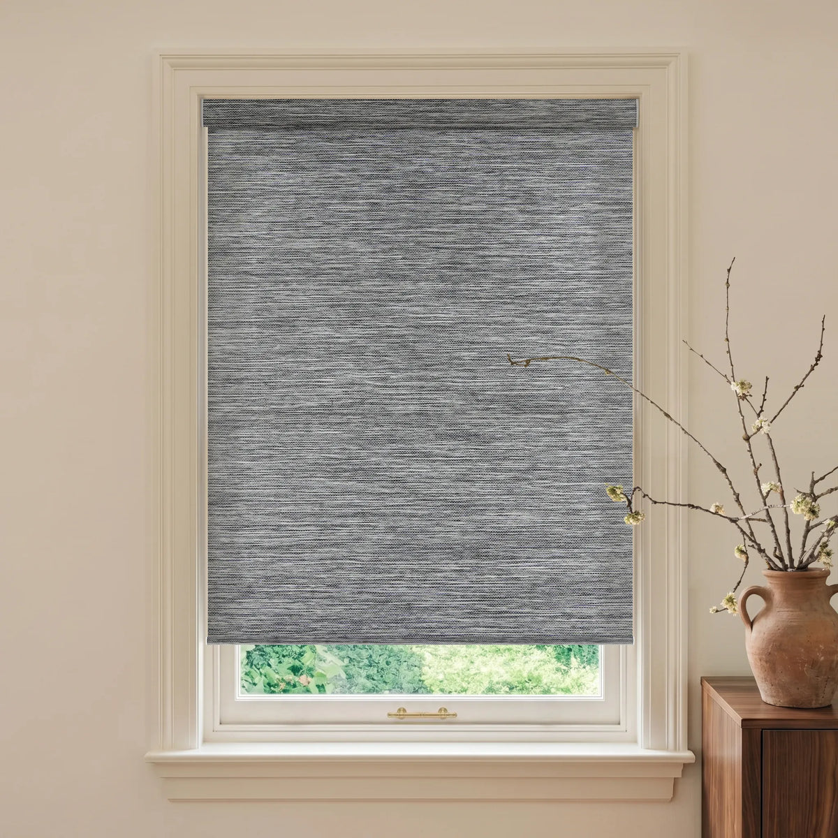 Mottled gray woven light filtering roller shades for soft natural light and privacy