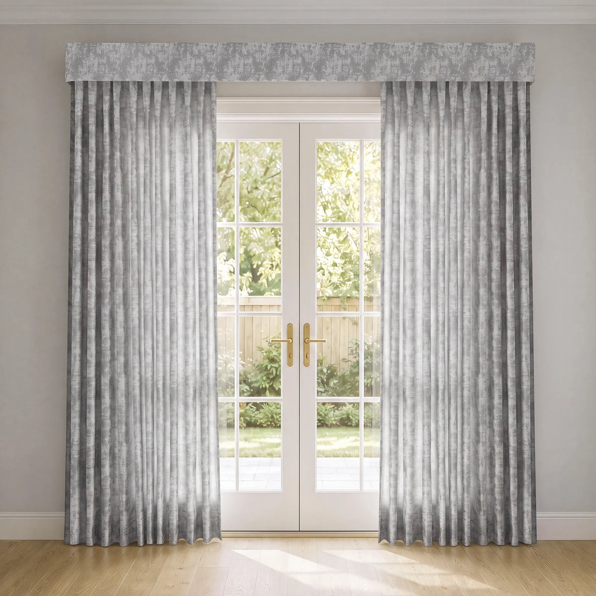 A pair of floor-length gray curtains with a subtle textured pattern, hanging on either side of white French doors. A matching gray patterned valance is draped across the top of the window, and a light wood floor is visible in the foreground.