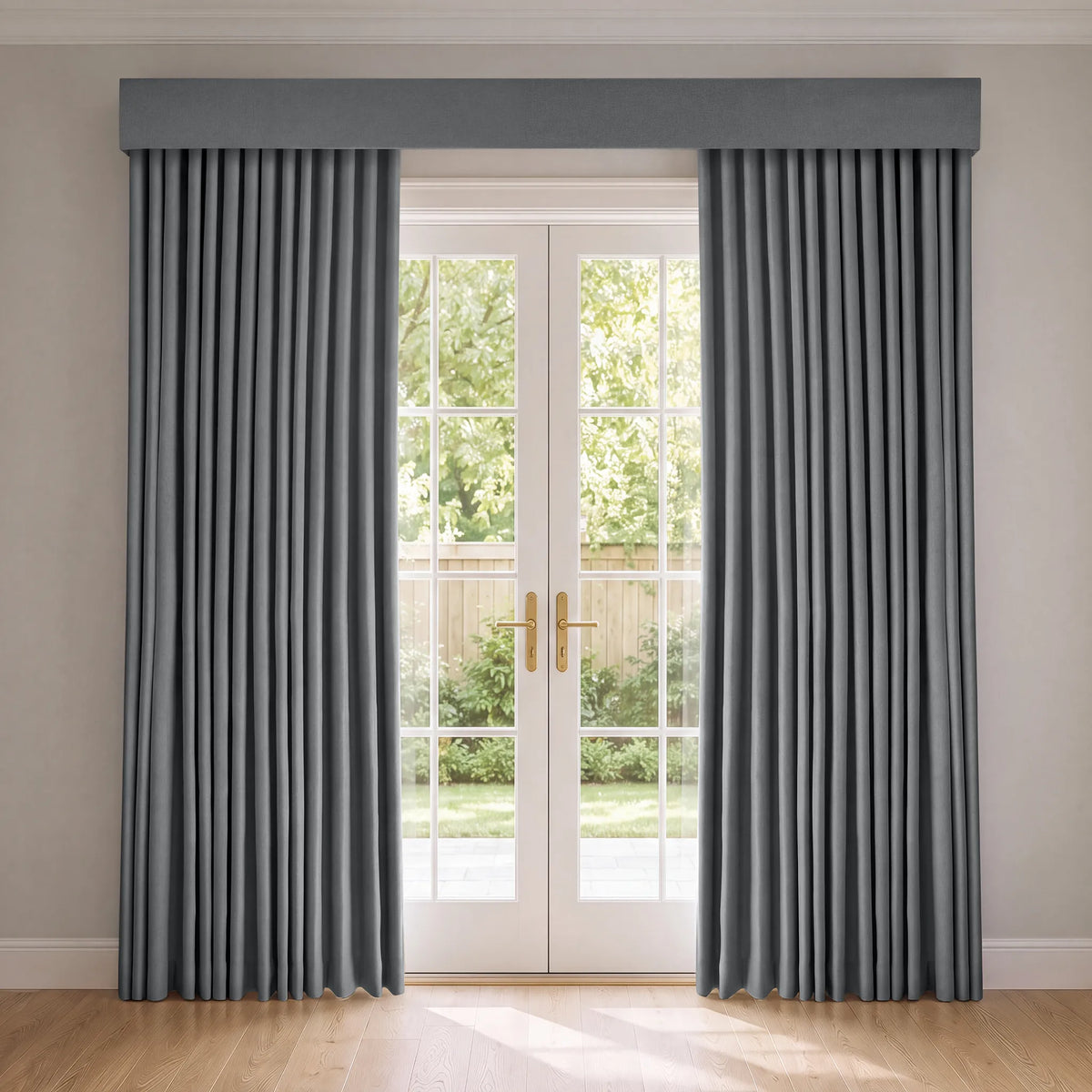 A pair of floor-length gray curtains with a matching valance hanging on either side of white French doors, set in a room with light beige walls and a light wood floor.