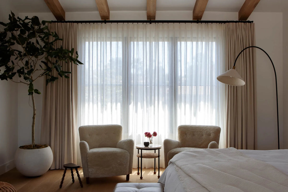 Choose this combination if you want a space to feel soft, bright, and adaptable throughout the day. The sheer layer filters daylight to keep the room airy, while the blackout drapery adds privacy and stronger light control when needed. It is a versatile option for homes that want brightness by day and fuller coverage at night.