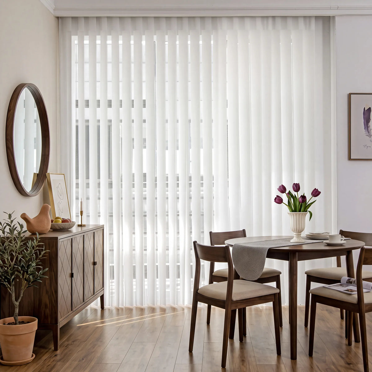 White Smart Sheer Vertical Blinds hanging in a dining room setting with a wooden table, chairs, and a sideboard.