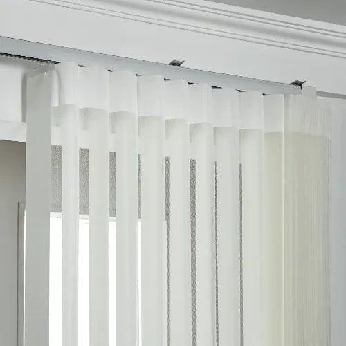 White Smart Sheer Vertical Blinds hanging from a silver metal rod on a window, shown in a clean interior setting.