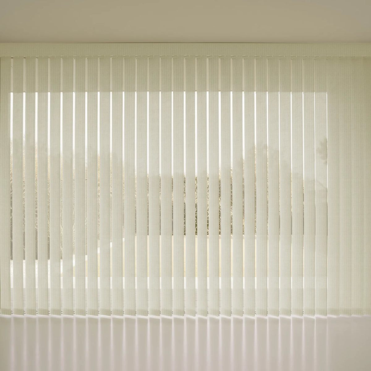 White Smart Vertical Blinds  with a slatted design, shown installed on a window in a minimalist interior setting.