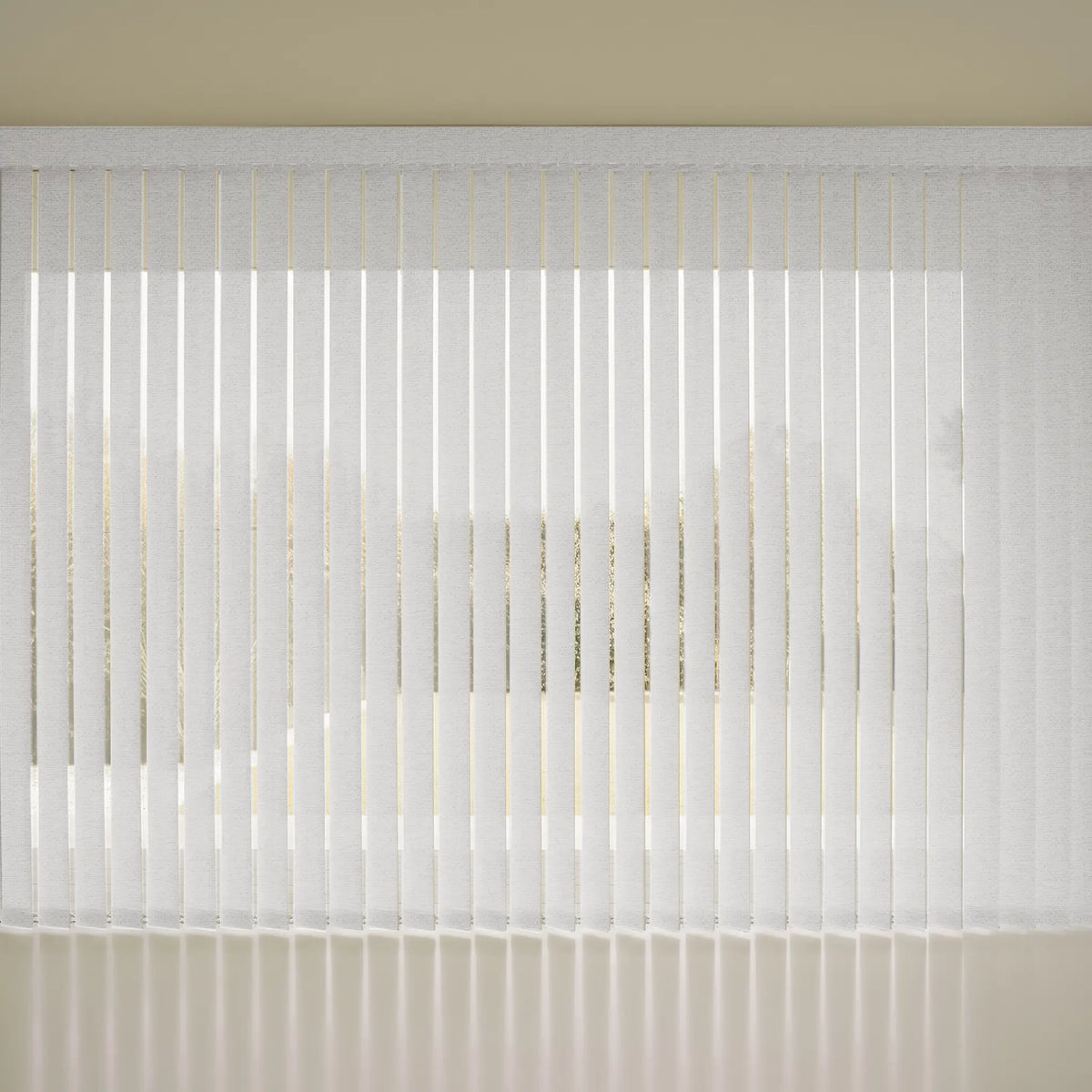 White vSmart Vertical Blinds  hanging in front of a window, casting soft vertical shadows on a light beige wall and floor.