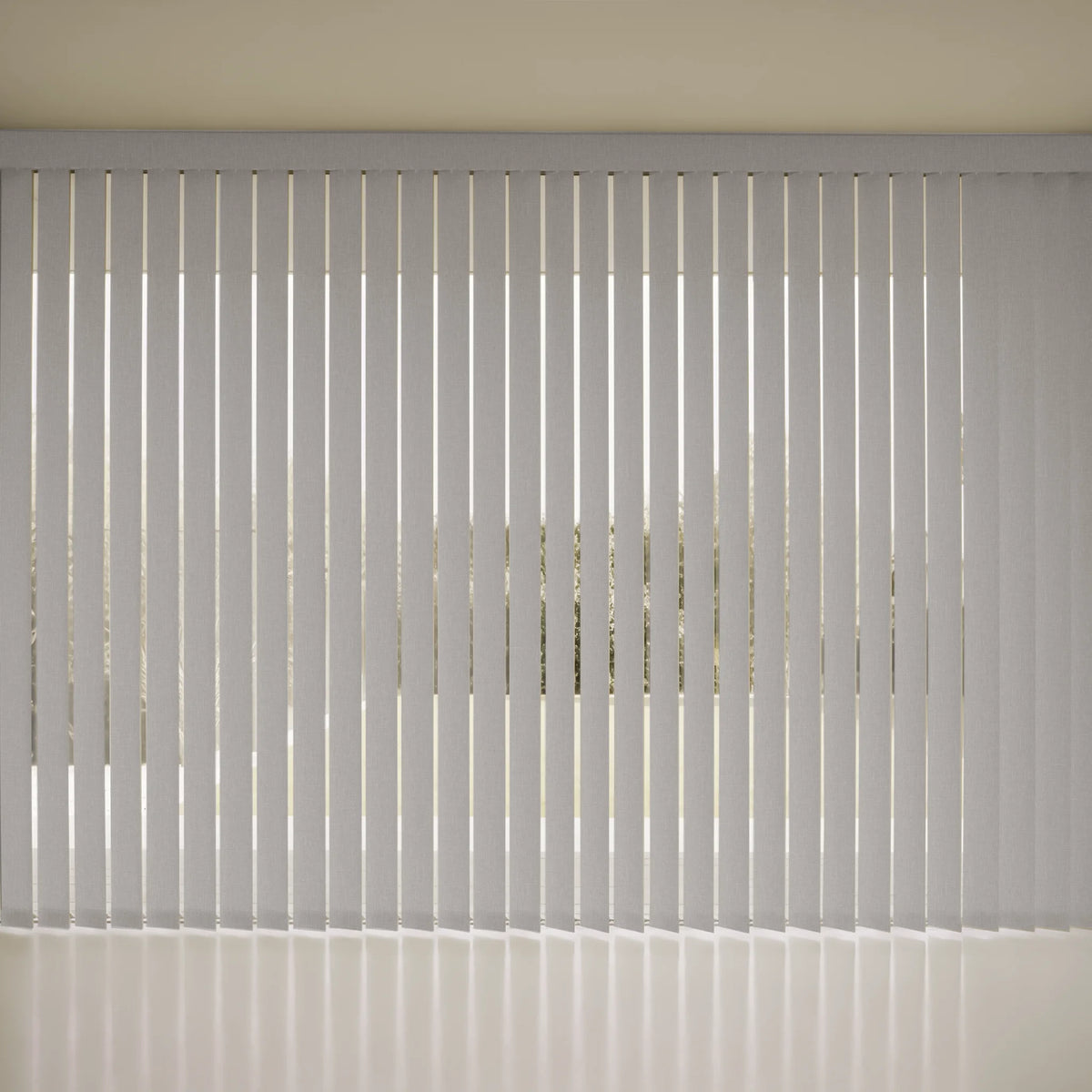 White Smart Vertical Blinds covering a window, with a beige wall and floor visible in the background.