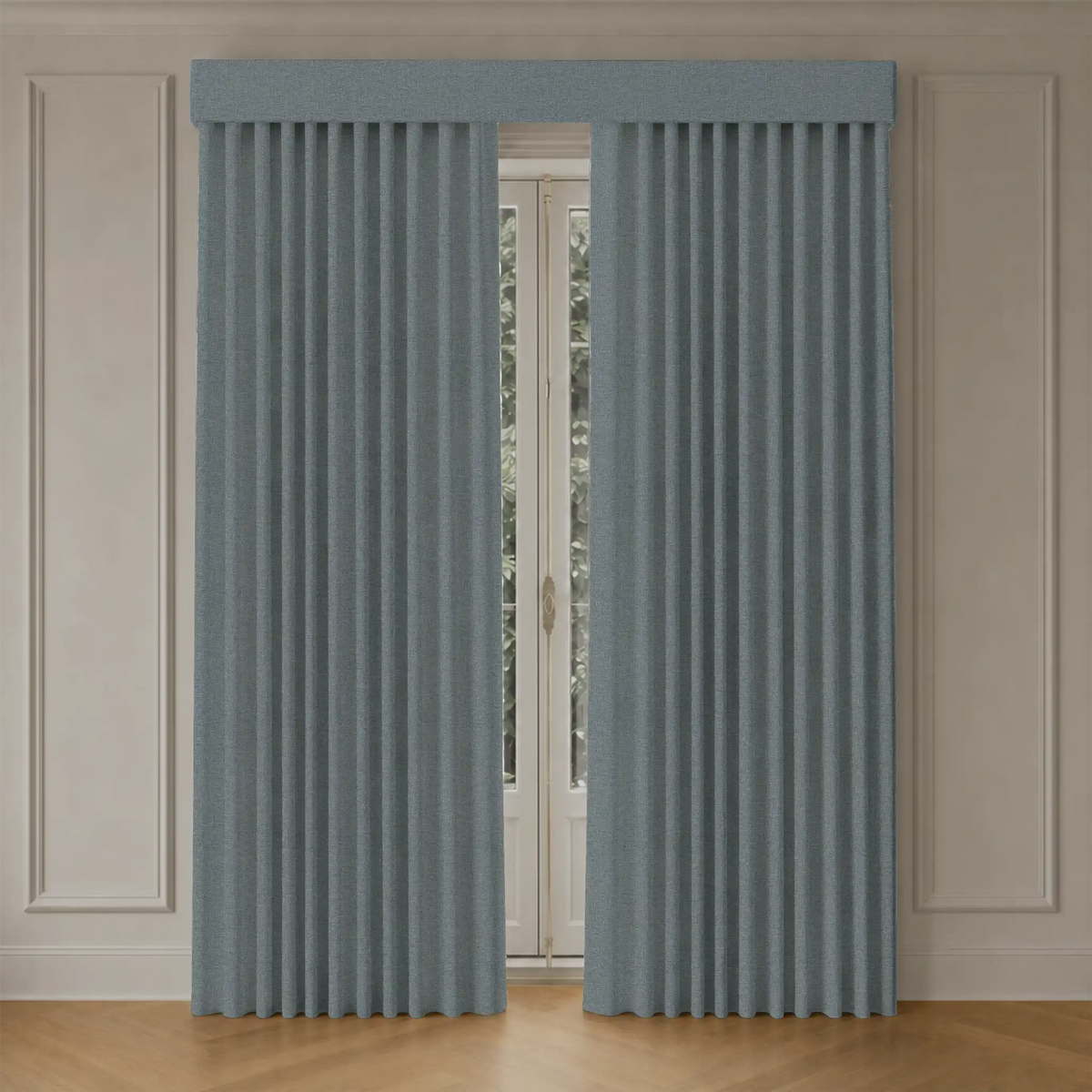 Pair of blackout curtains with track in a room with wooden flooring and white walls.