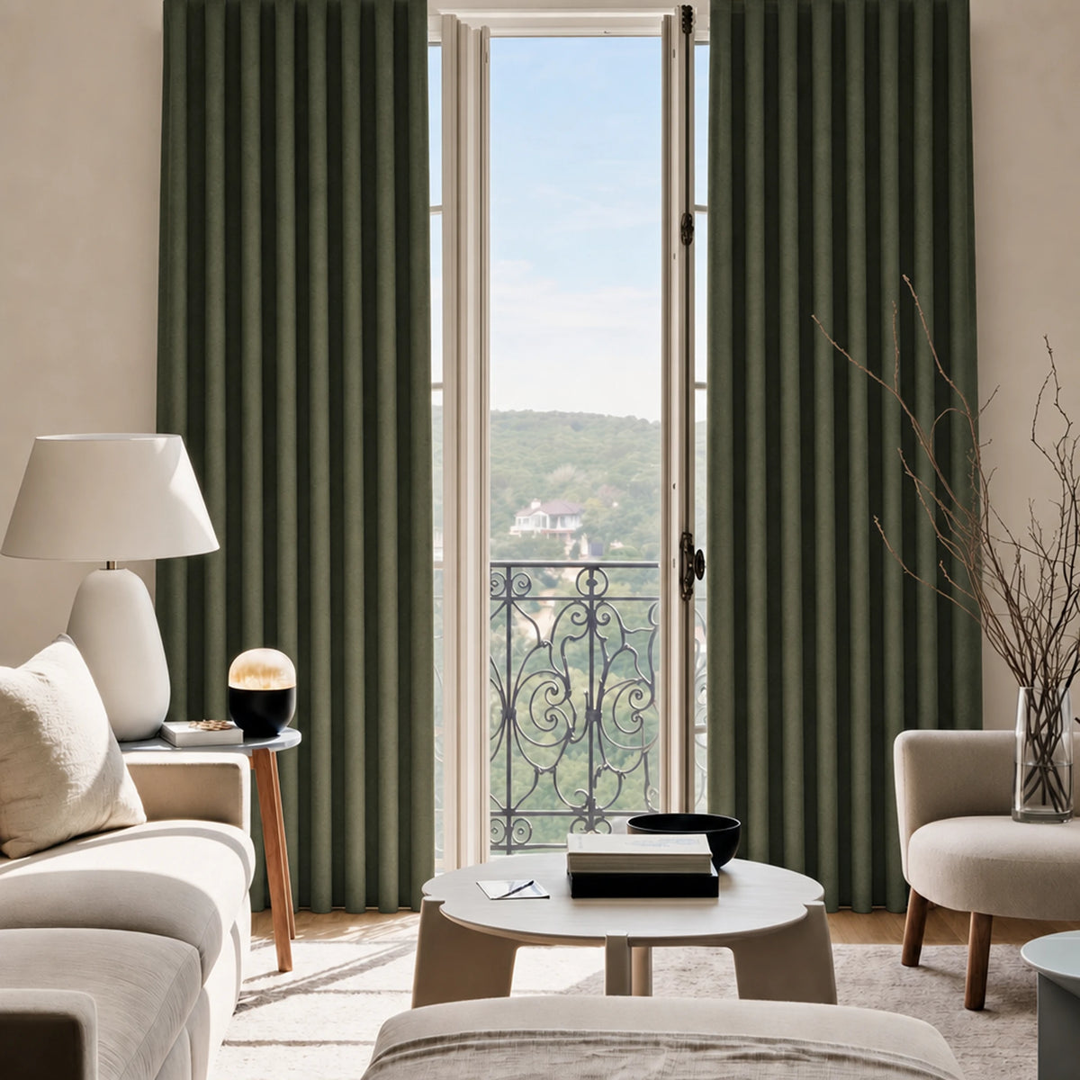 Modern living room with green curtains, a table, and chairs.