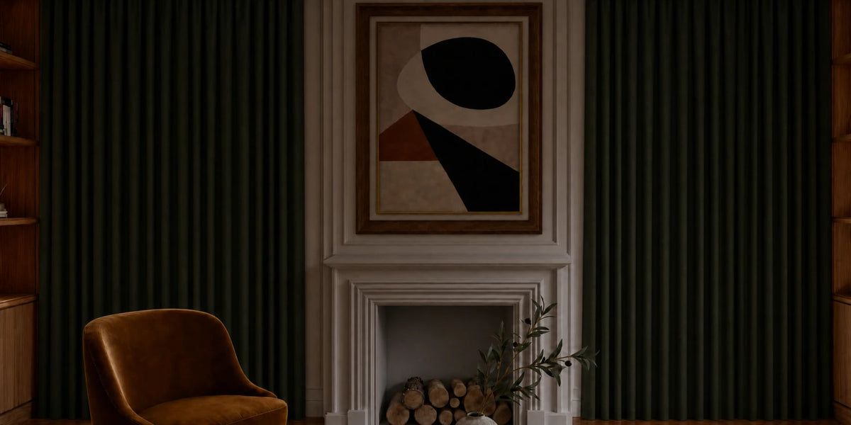 Cozy living room with a brown armchair, fireplace, and abstract art above.
