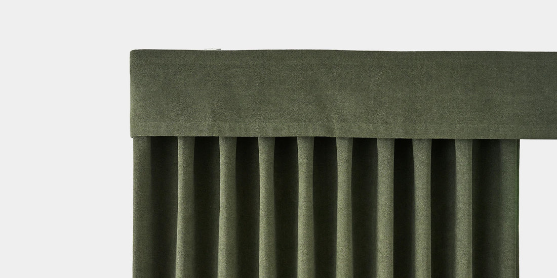 Green pleated curtain on a white background