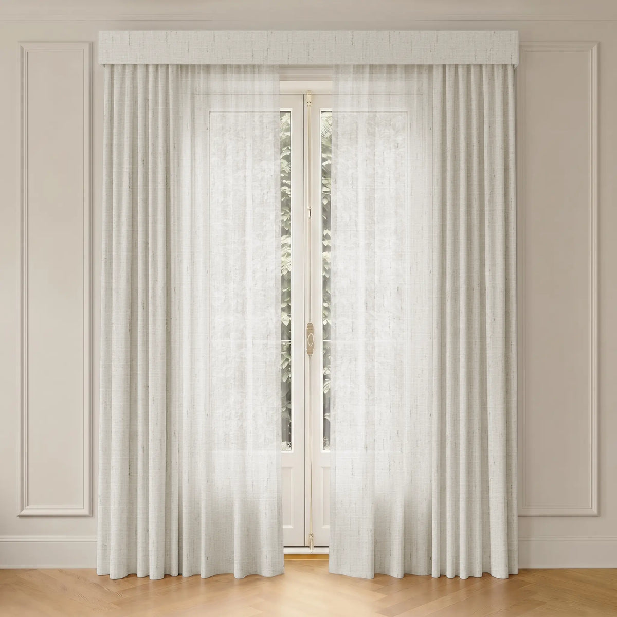 Sheer curtains with track hanging in front of a glass door with a neutral wall background