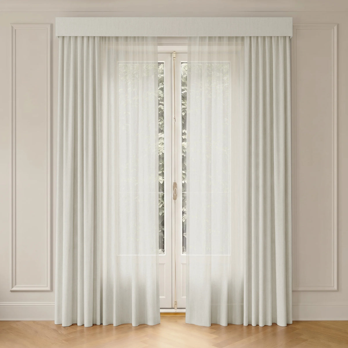 Sheer curtains hanging in front of a window with a neutral wall background