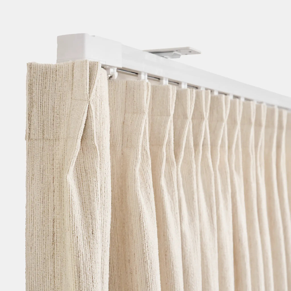 Beige curtain with white rod on a white background