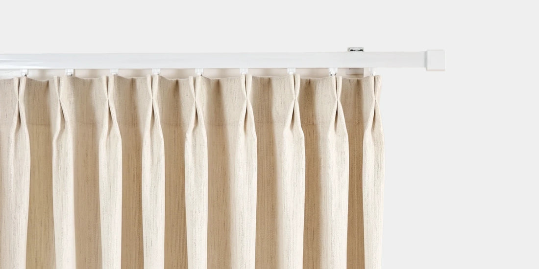 Beige striped curtain on a white background