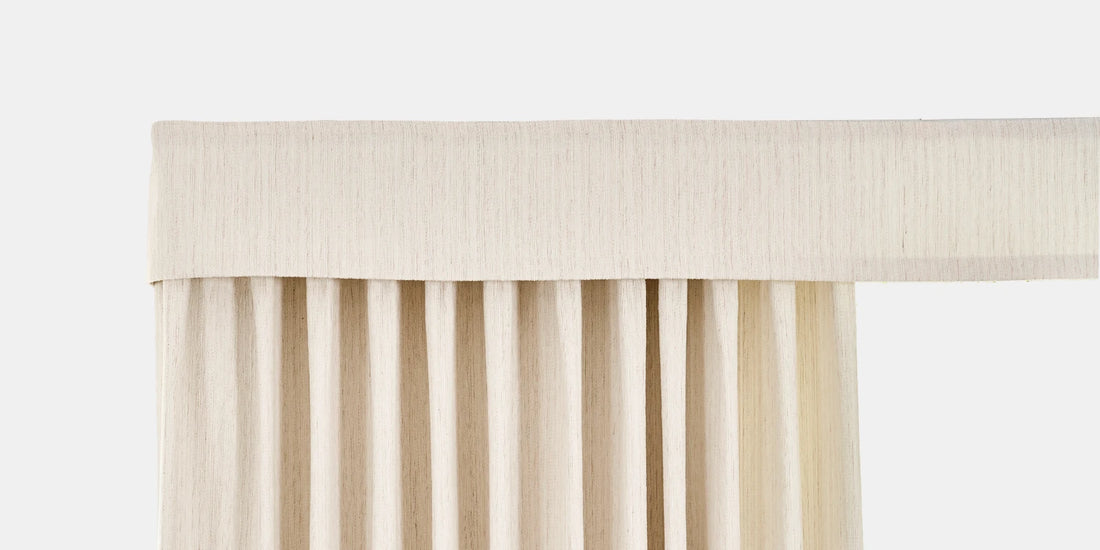 Beige pleated curtain on a white background
