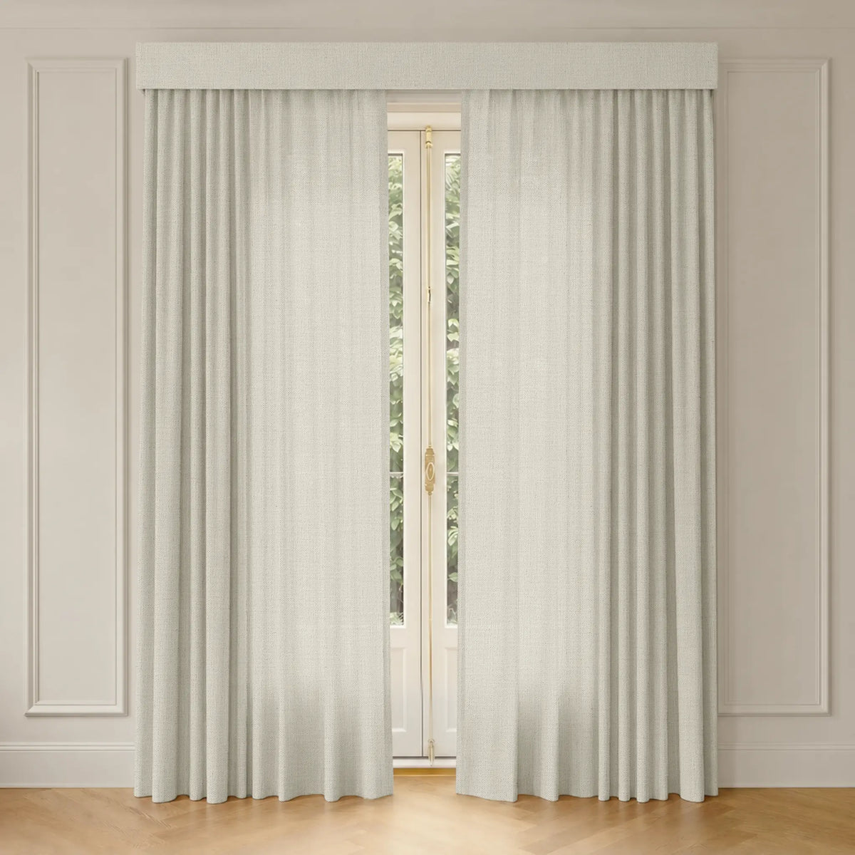 Sheer white curtains with track in front of a window with a neutral wall background