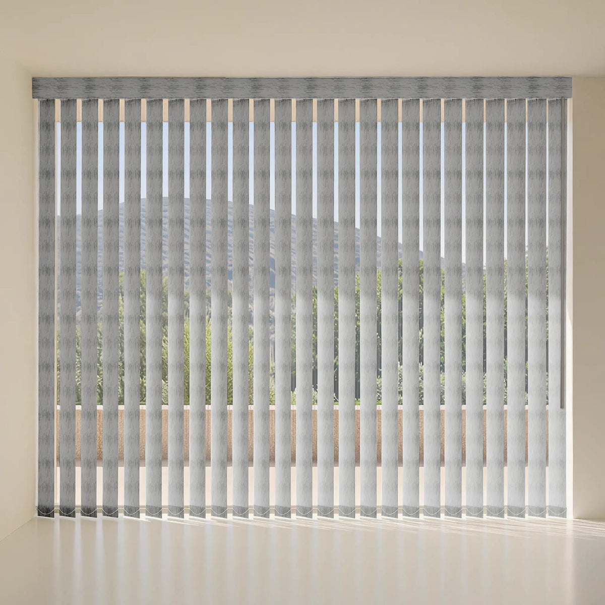 Gray vertical blind curtains with a subtle pattern, shown hanging in front of a window in a minimalist room setting.