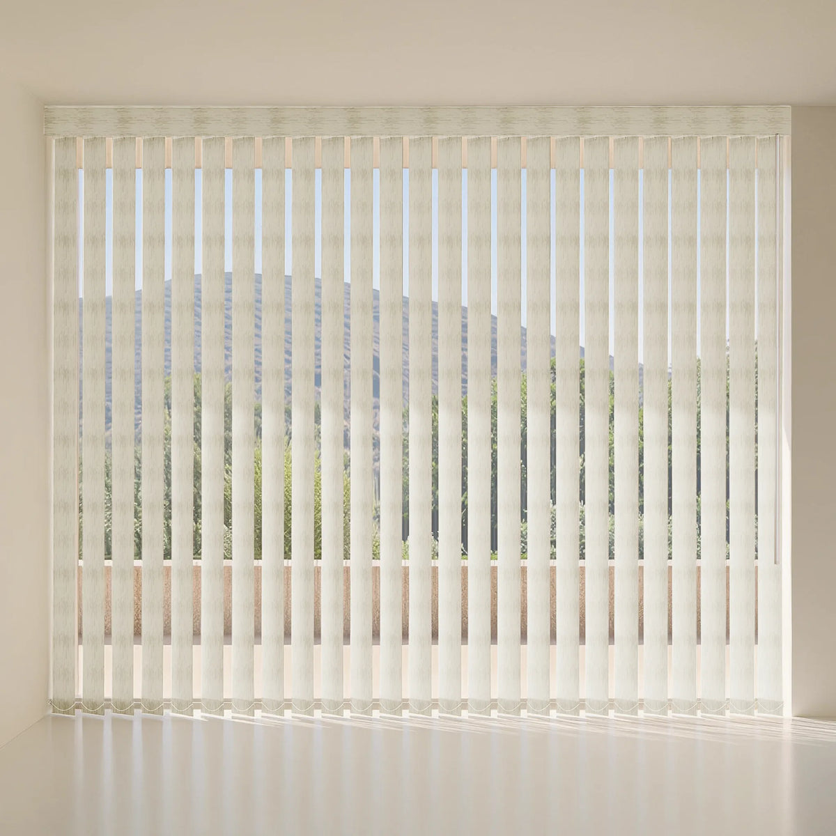 Beige vertical blind with a sheer textured fabric, shown installed on a window in a minimalist, brightly lit room.