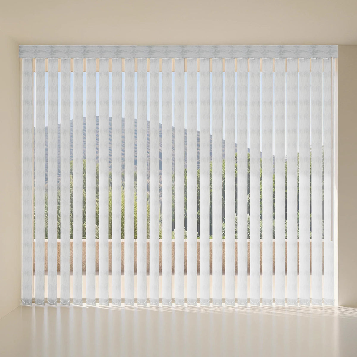 White vertical blind with a pleated header, shown installed on a window in a minimalist room with beige walls and floor.