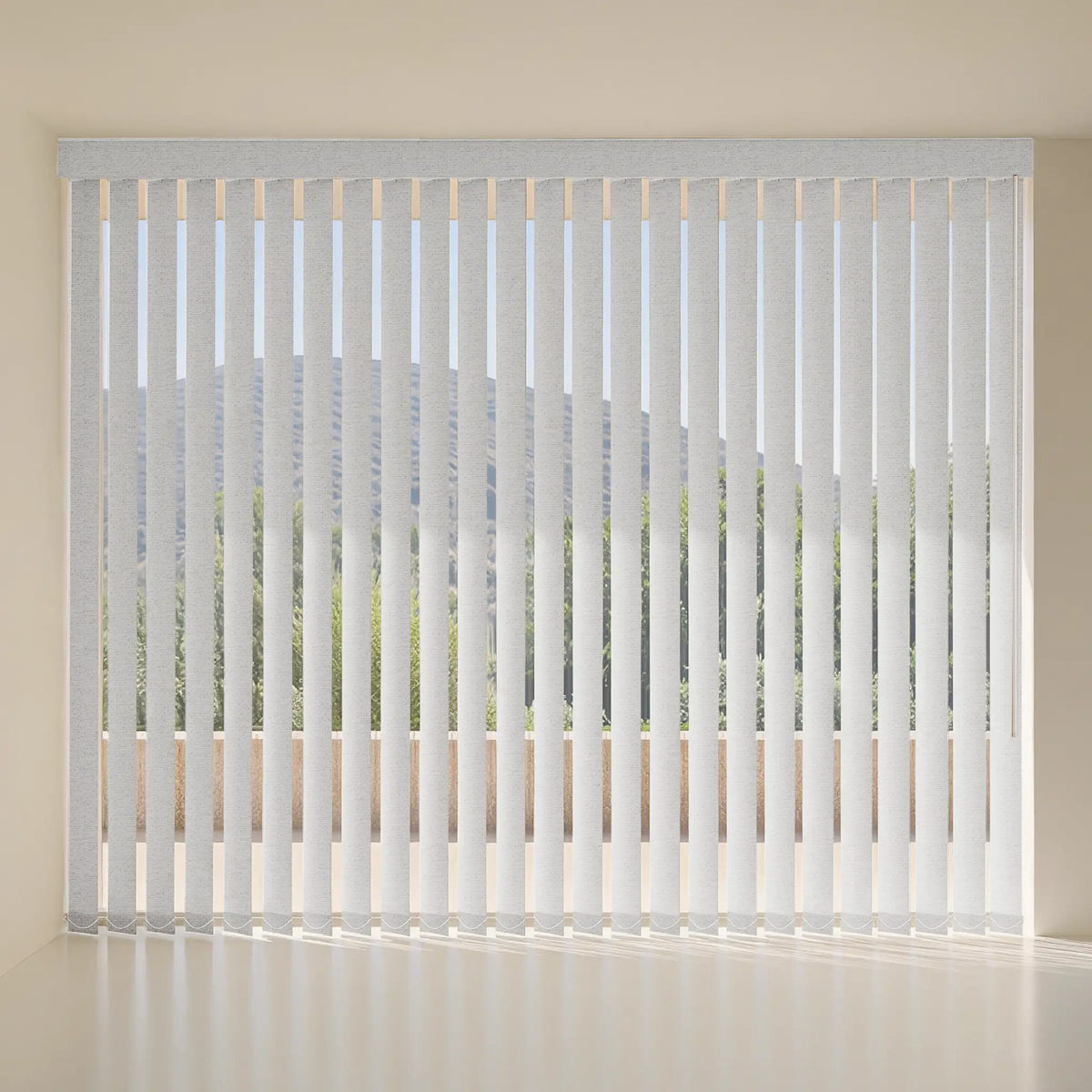 White vertical blinds with a textured fabric cover, hanging on a window in a minimalist room with beige walls.