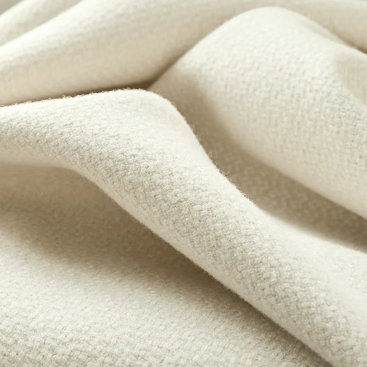 Softer, warmer, and more substantial in hand, wool-blend fabrics lend a room a greater sense of comfort and depth. They are especially fitting for interiors that benefit from a cozy, inviting atmosphere.
