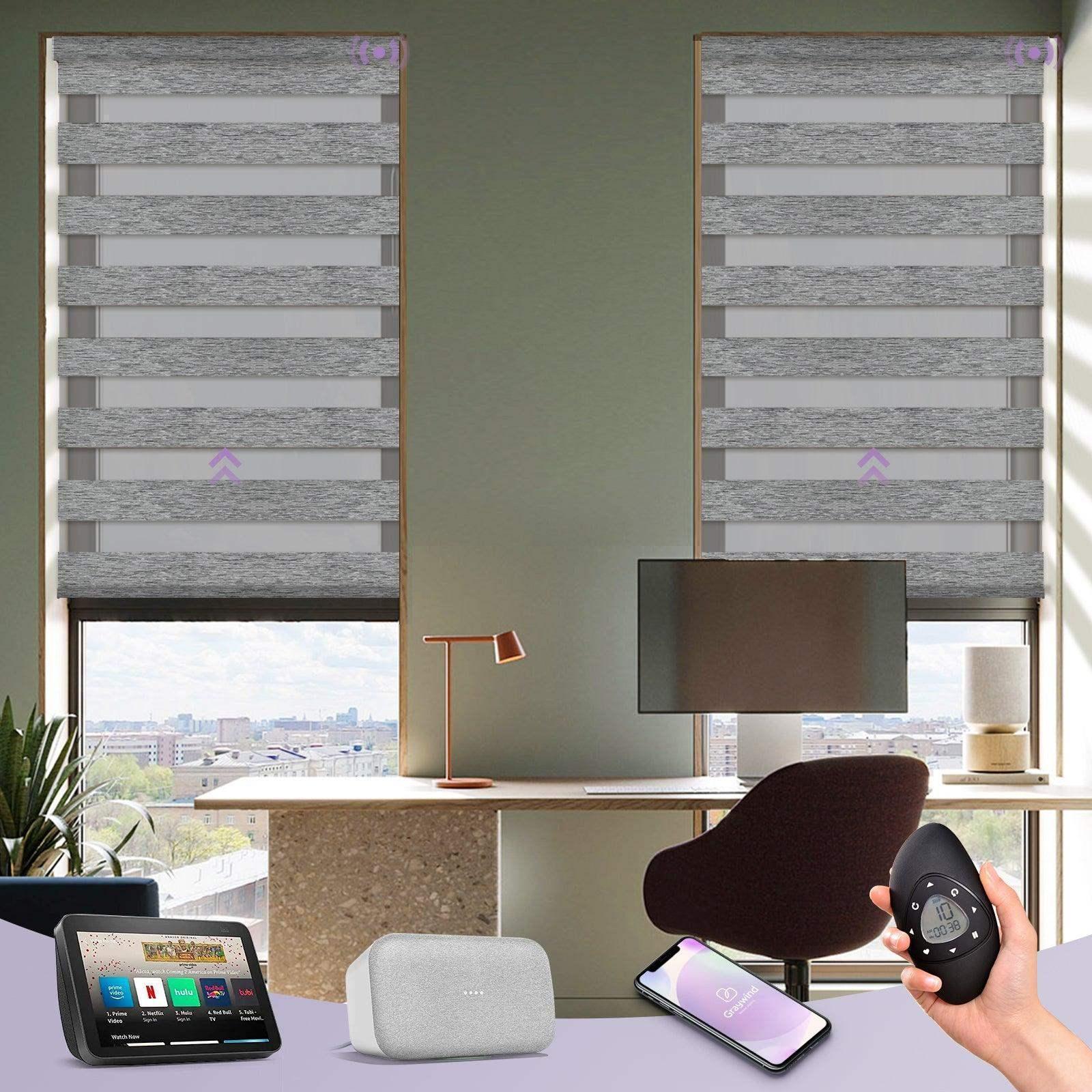 Modern home office with gray zebra roller shades, smart hub, smartphone, and remote control