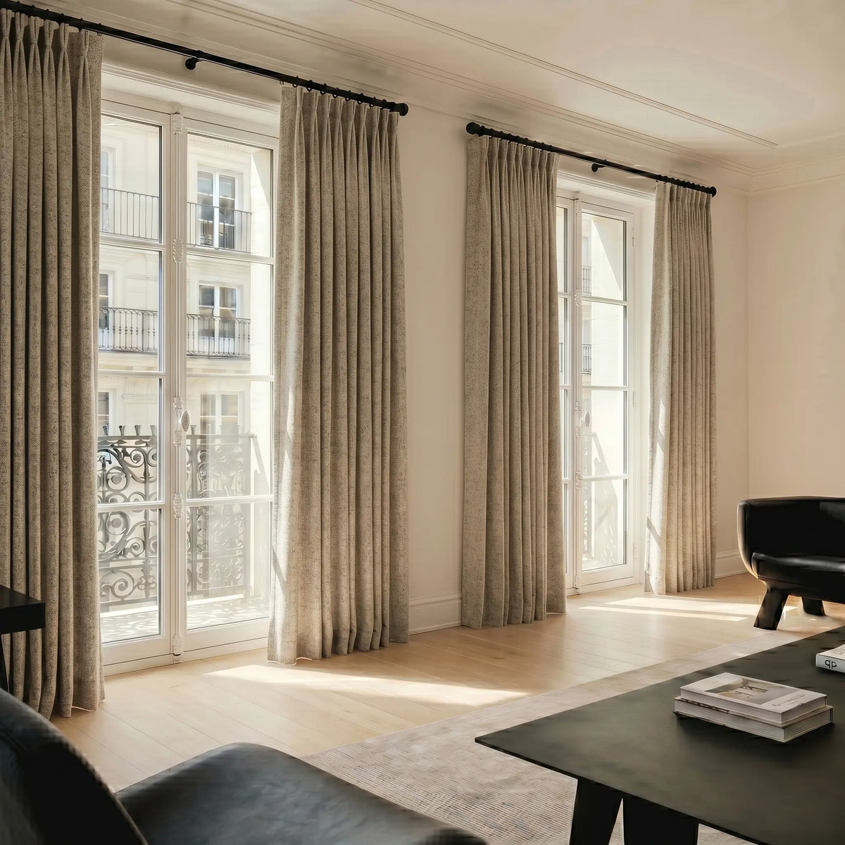 Living room with large windows and  motorized blackout curtains