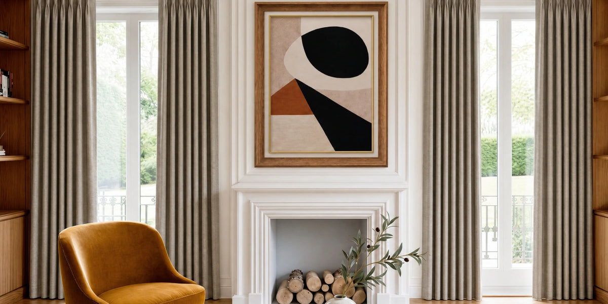 Living room with a fireplace, abstract art, and curtains.